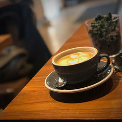 High angle view of coffee cup on table