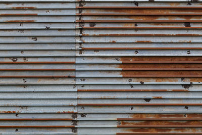 Rusted corrugated steel sheets background and texture