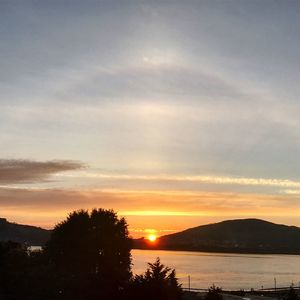 Scenic view of silhouette mountains against sky during sunset
