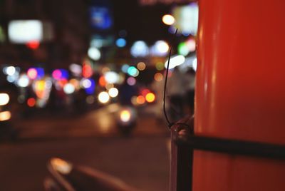 Close-up of illuminated city street at night