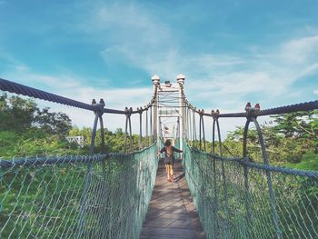 People walking on footbridge