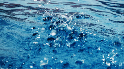 Close-up of water splashing in swimming pool