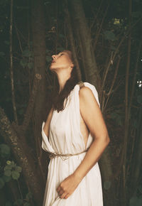 Woman with tunic inside the forest viii