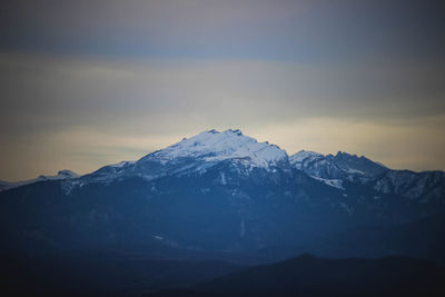 Scenic view of snowcapped mountains against sky