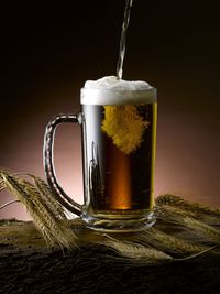 Close-up of beer glass on table