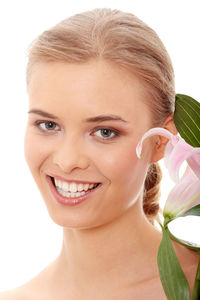 Close-up portrait of a smiling young woman