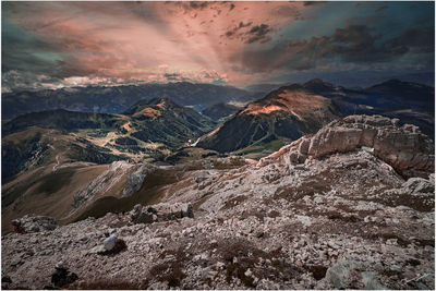 Aerial view of mountain range against sky during sunset