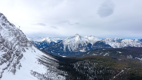 Scenic view of mountains against sky during winter