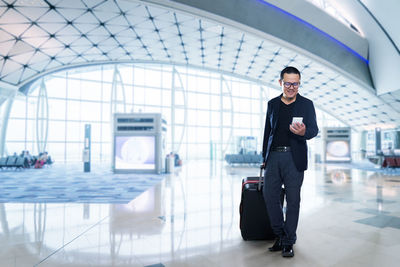 Full length of man standing at airport