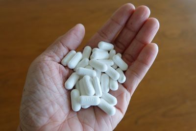 Close-up of hand holding pills