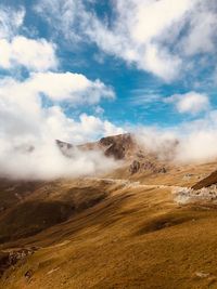 View of landscape against cloudy sky