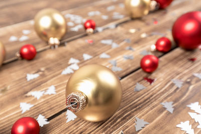 High angle view of baubles on wooden table