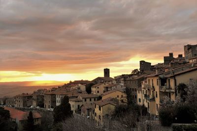 Buildings in town at sunset