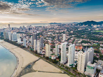 High angle view of modern buildings in city against sky