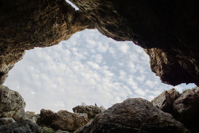 Low angle view of rock formation against sky