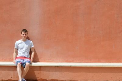 Man standing on wall