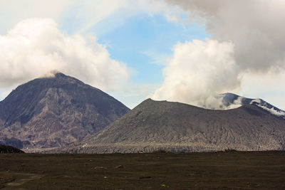 Panoramic view of volcanic landscape against sky