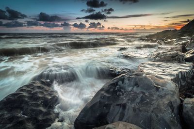 Scenic view of sea at sunset