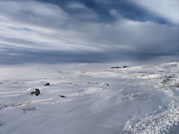 Scenic view of snow covered mountain against sky