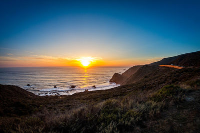 Scenic view of sea against sky during sunset