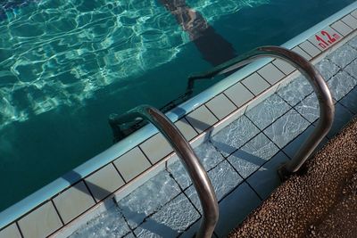 High angle view of ladder in swimming pool