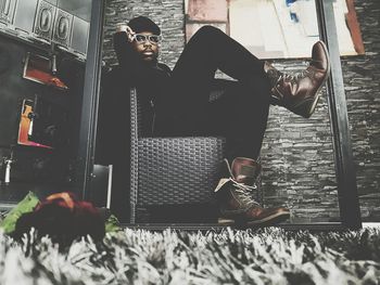 High angle view of young woman on floor