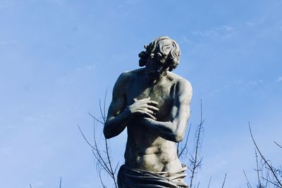 Low angle view of statue against sky