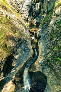 High angle view of water flowing through rocks