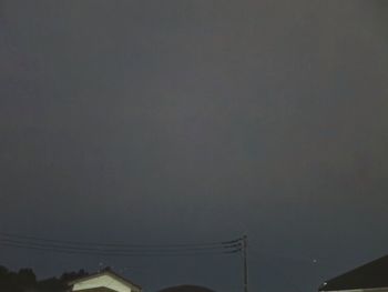 Low angle view of cables against sky