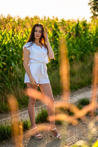 Young woman standing on field