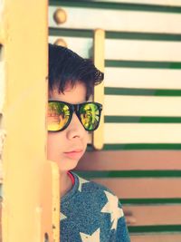 Portrait of boy looking through camera