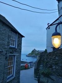 Low angle view of illuminated house against sky