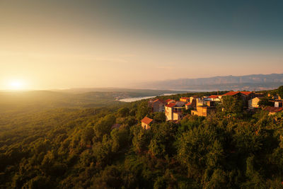 High angle view of townscape against sky at sunset