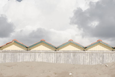 Gazebo on beach against sky