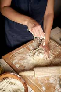 Midsection of woman preparing food