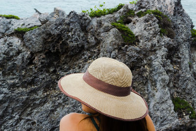 Rear view of woman on rock