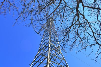 Low angle view of tower against clear blue sky
