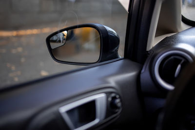 Close-up of sunglasses on car