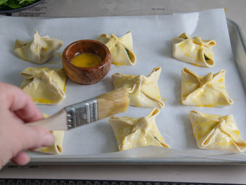 High angle view of person preparing food on table