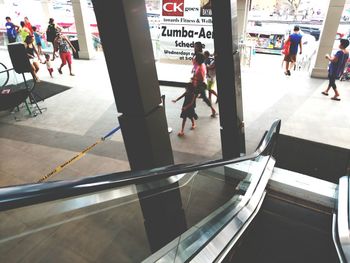 People walking on railroad station platform
