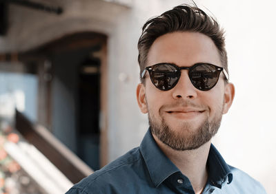 Close-up of smiling man wearing sunglasses