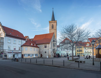 Buildings in city against sky