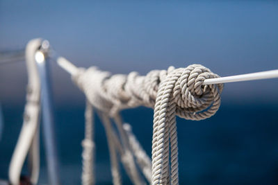 Close-up of rope tied to pole