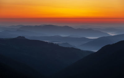 Scenic view of silhouette mountains against sky during sunset in rodnei mountains 