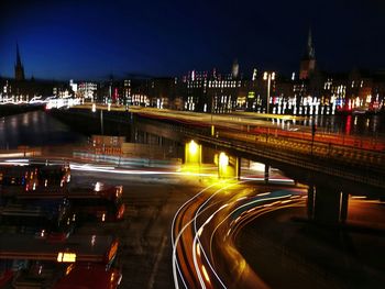 Light trails on road in city at night