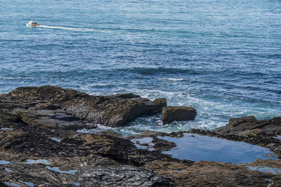 Scenic view of rocks in sea