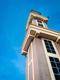 Low angle view of building against blue sky