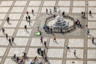 High angle view of people walking in city