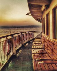 Pier on sea at sunset