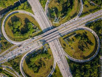 High angle view of highway amidst trees in city